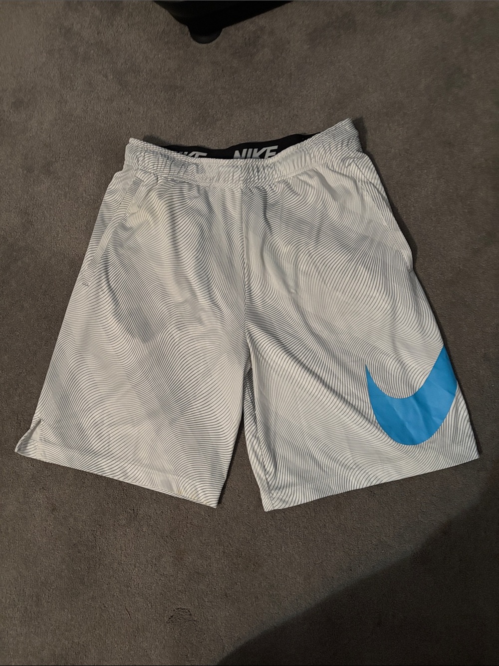 Nike Men’s White Athletic Shorts with Blue Swoosh